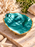Turquoise decorative oyster shell with gold-toned edges and pearl-like accents