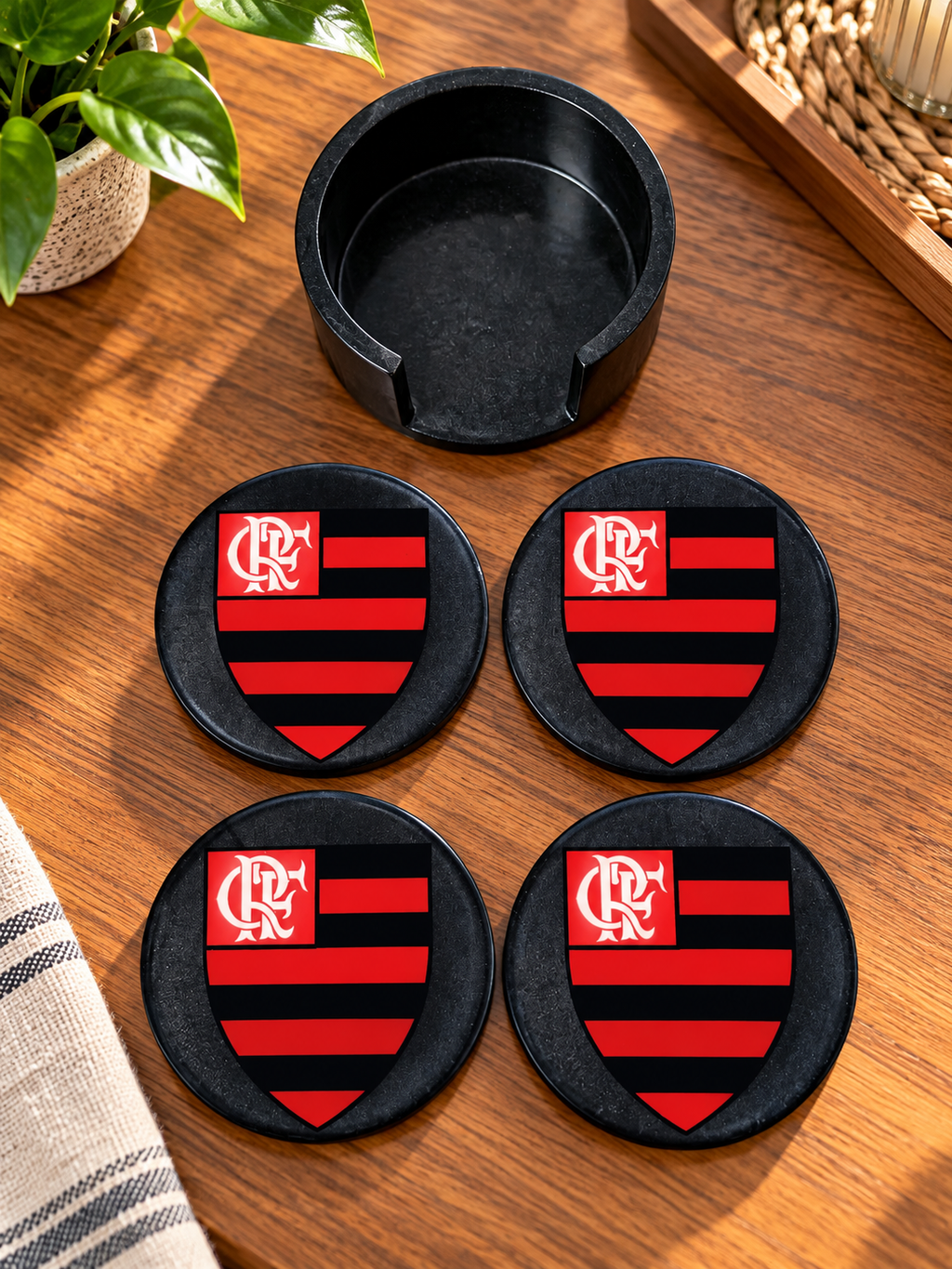 Four black Flamengo coasters with a matching holder