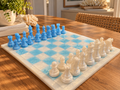Handmade blue and white chessboard with matching chess pieces
