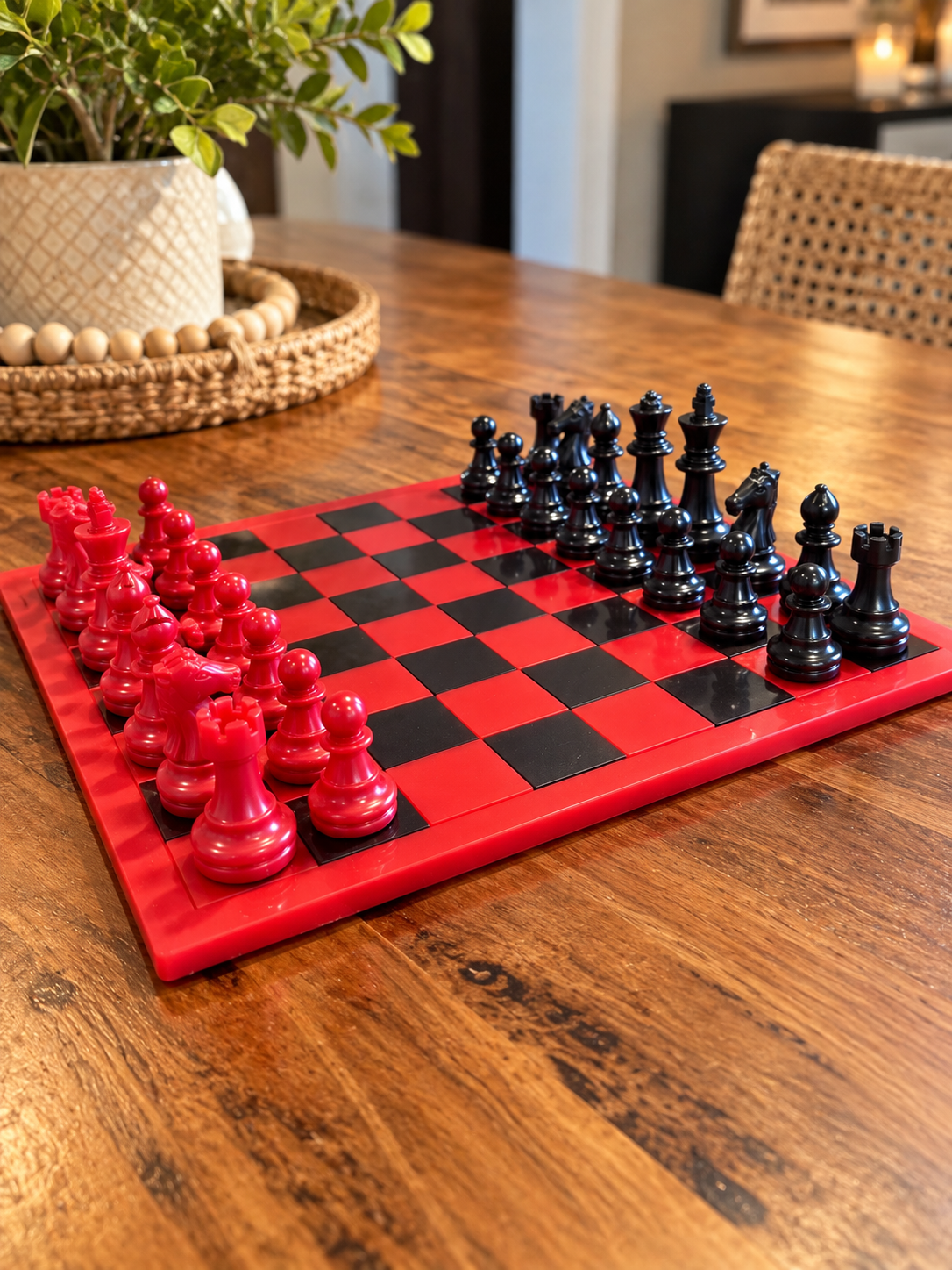 Glossy red and black chessboard with red and black chess pieces