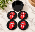 Set of four black Rolling Stones coasters with red-and-white tongue designs and a black holder