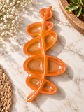 Glossy orange leaf-inspired jewelry dish with curved compartments
