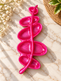 Glossy pink leaf-inspired jewelry dish with curved compartments