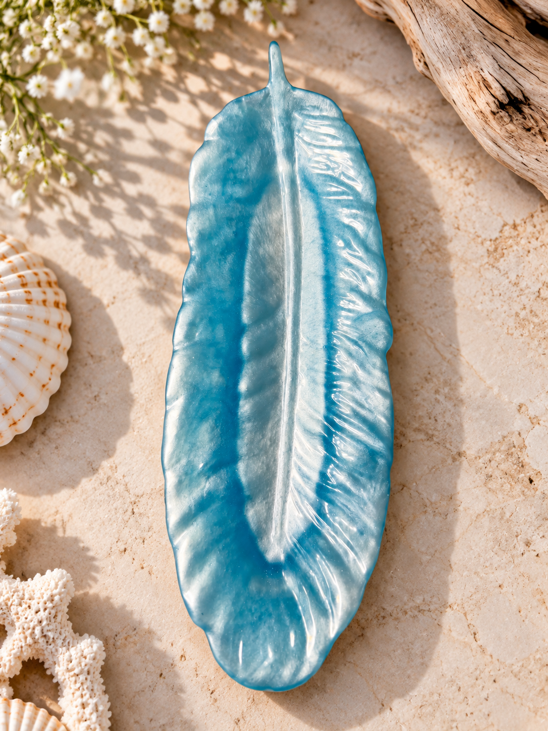 Blue feather-shaped jewelry holder