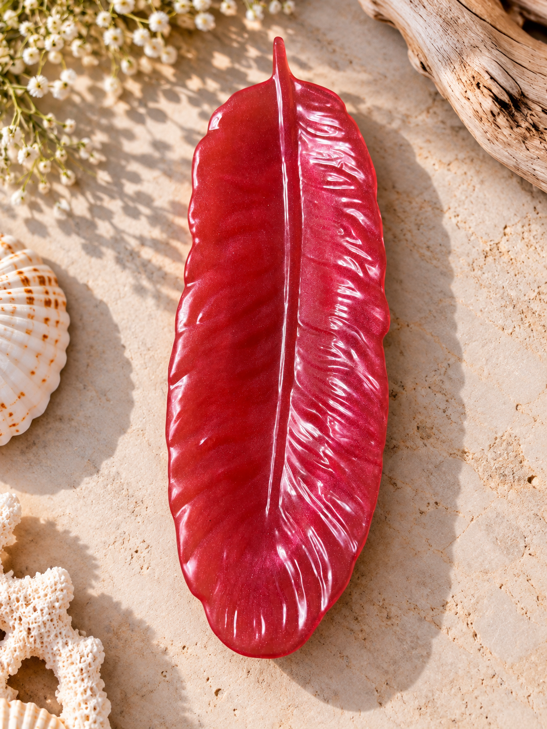 Red feather-shaped jewelry holder