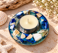 Blue resin candle holder with shell accents and included candle