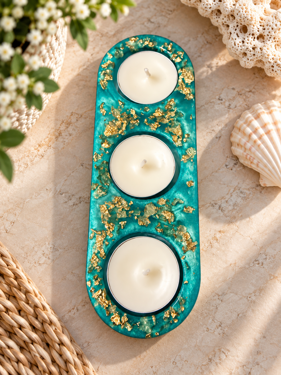 Turquoise resin holder with gold-colored accents and three included candles